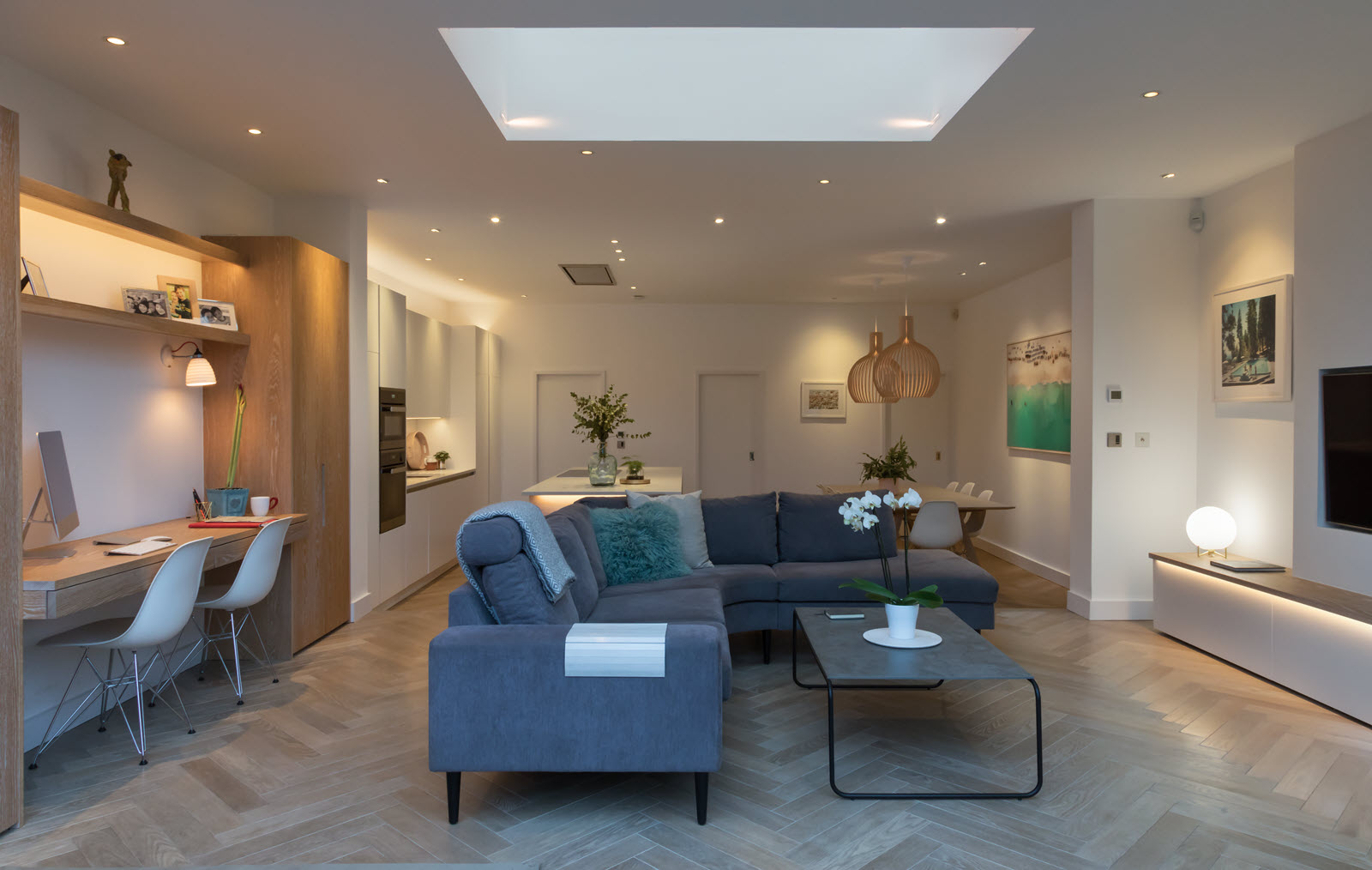 Pendant lighting and integrated lighting in the open plan living area of a home renovation in Kingston.